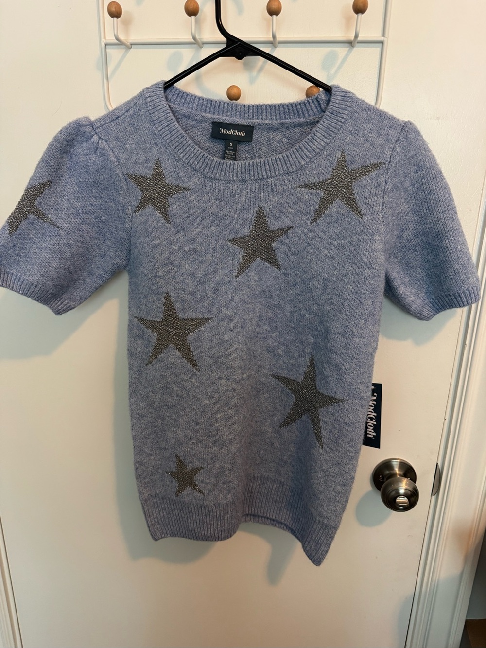 ModCloth blue Short‑Sleeve Star Sweater with shiny Charcoal Stars